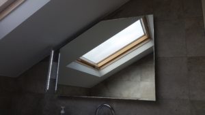 Shaped mirror with steam demister and side light for attic bathroom in Leopardstown Co Dublin BA 0504m